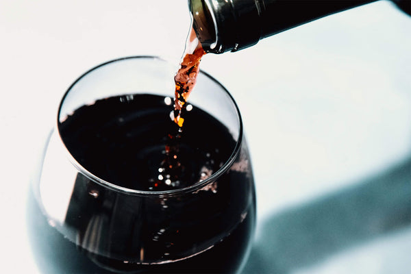 Maison Noire wine reviews - image of red wine pouring into a glass